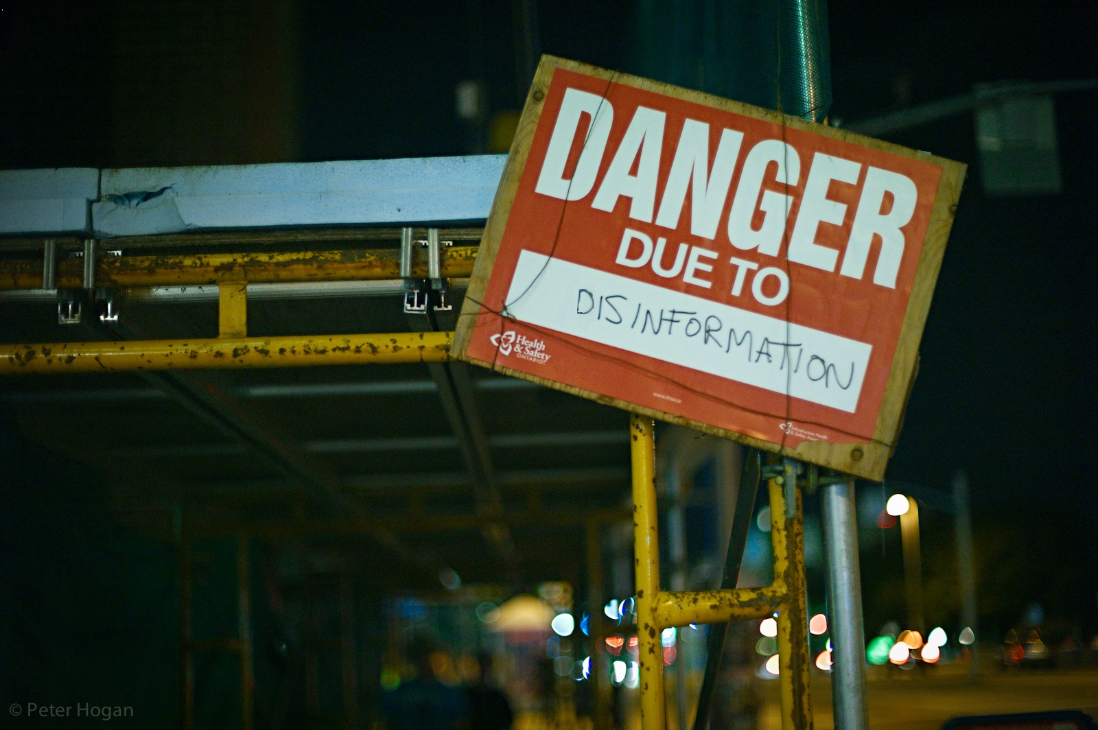 Sign which states "Danger due to disinformation"