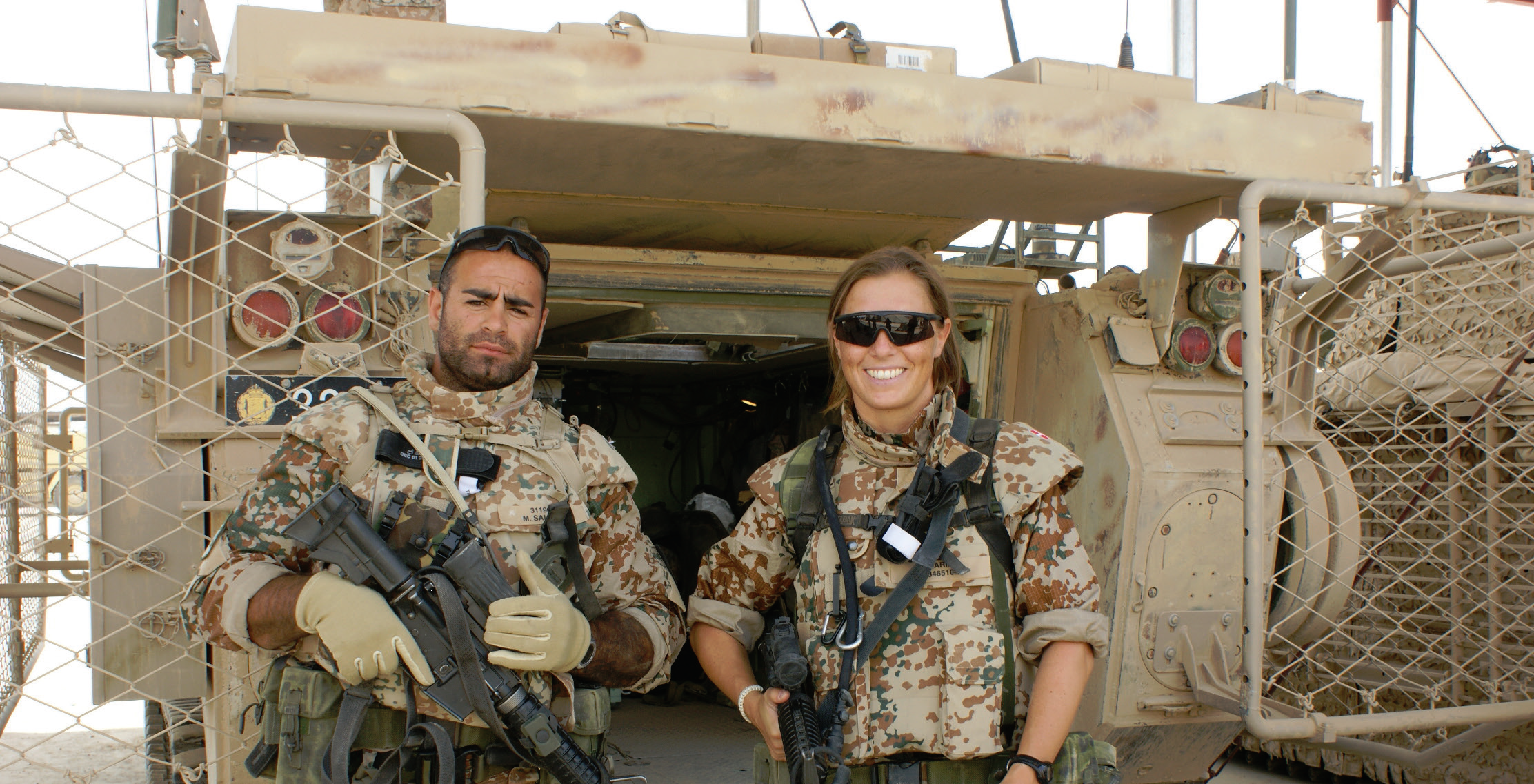 Soldiers in front of tank